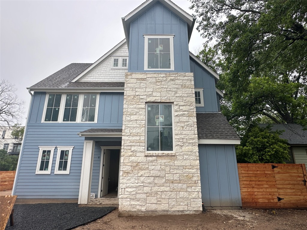 a front view of a house with garage
