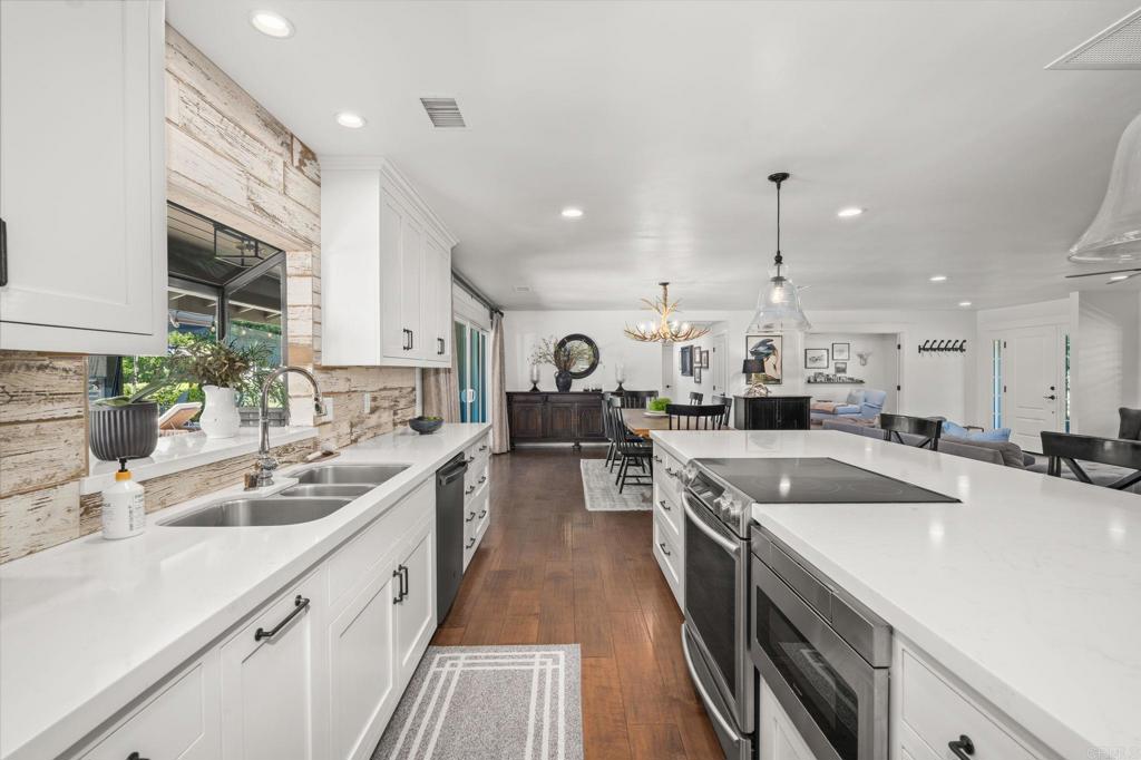1848 Tavern Road Alpine, CA 91901 - Photo 11 of 45 a kitchen with a sink a counter top space stainless steel appliances and a window