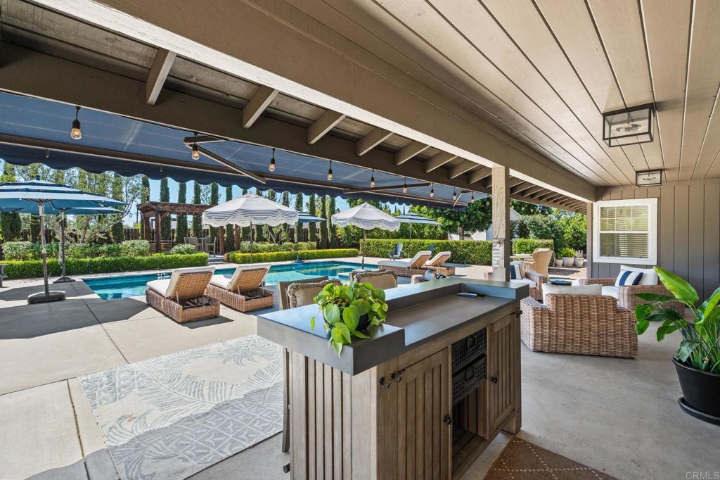 1848 Tavern Road Alpine, CA 91901 - Photo 16 of 45 a view of a patio with couches chairs and a flower pot