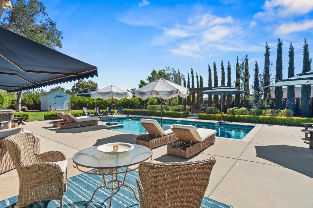 1848 Tavern Road Alpine, CA 91901 - Photo 17 of 45 a view of a patio with couches table and chairs under an umbrella
