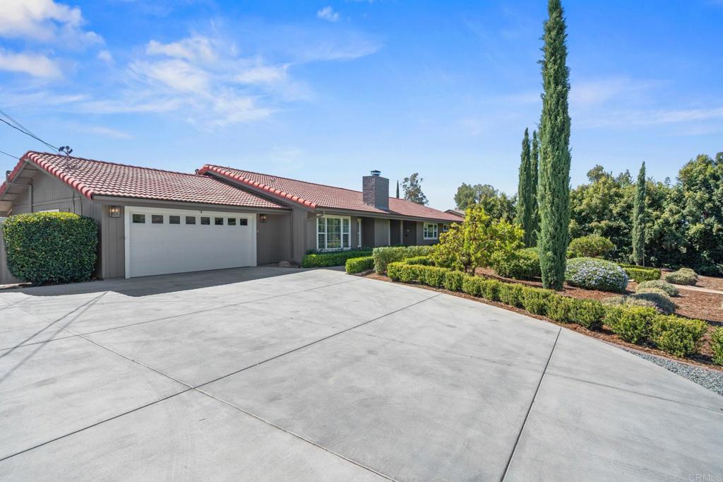 1848 Tavern Road Alpine, CA 91901 - Photo 2 of 45 a front view of a building with a garden