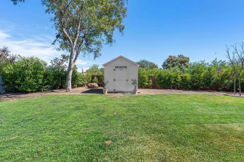 1848 Tavern Road Alpine, CA 91901 - Photo 26 of 45 a view of a house with a yard and a large tree