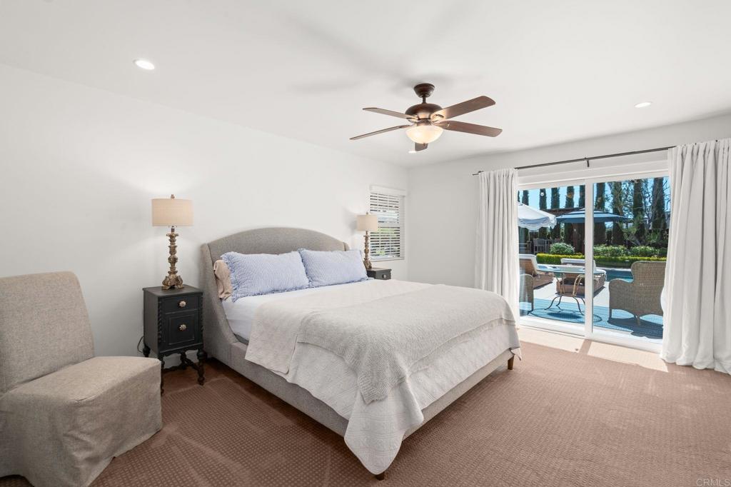 1848 Tavern Road Alpine, CA 91901 - Photo 27 of 45 a spacious bedroom with a bed and a chandelier