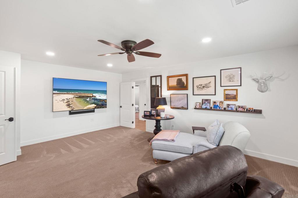 1848 Tavern Road Alpine, CA 91901 - Photo 35 of 45 a living room with furniture and a flat screen tv