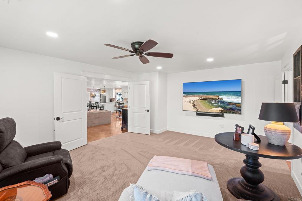 1848 Tavern Road Alpine, CA 91901 - Photo 36 of 45 a living room with furniture and a flat screen tv