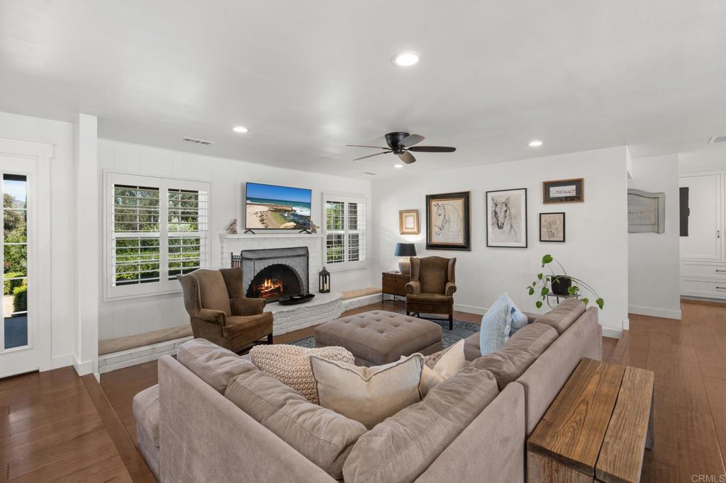 1848 Tavern Road Alpine, CA 91901 - Photo 6 of 45 a living room with furniture a fireplace and a large window