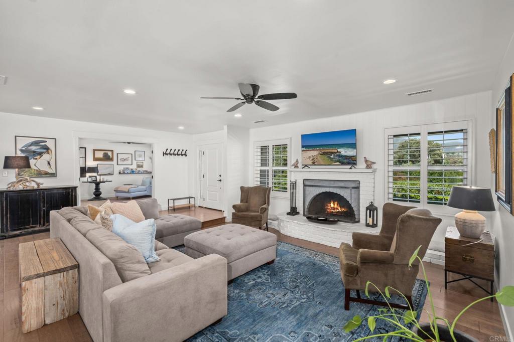 1848 Tavern Road Alpine, CA 91901 - Photo 7 of 45 a living room with furniture a fireplace and a large window