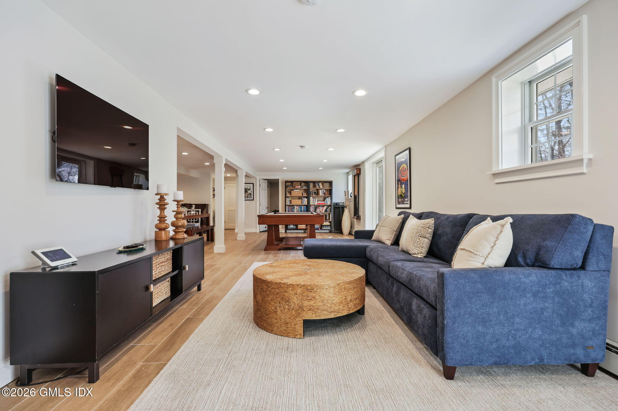 97 Davenport Ridge Lane Stamford, CT 06903 - Photo 23 of 31 a living room with furniture and a flat screen tv