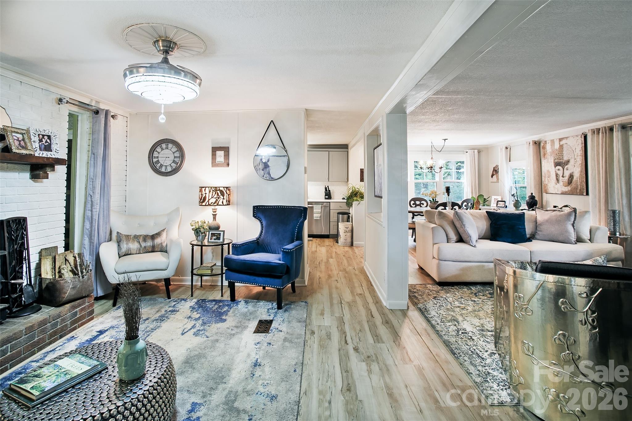 74 Huntley Road Fletcher, NC 28732 - Photo 23 of 45 a living room with furniture a rug and a clock
