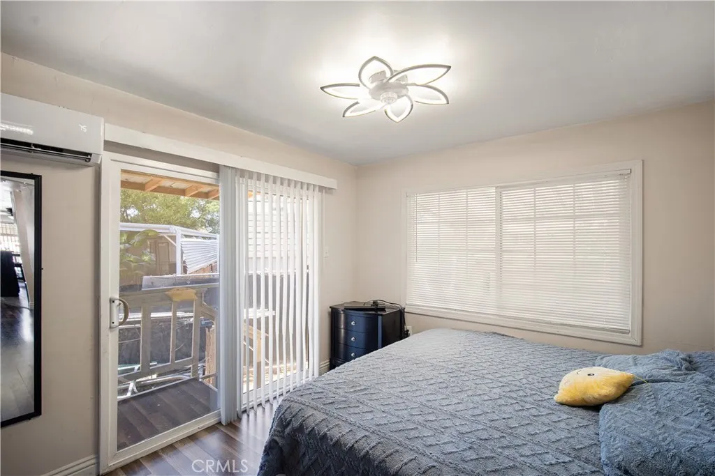 348 Petrol Road Bakersfield, CA 93308 - Photo 17 of 21 a bedroom with a bed and a chandelier