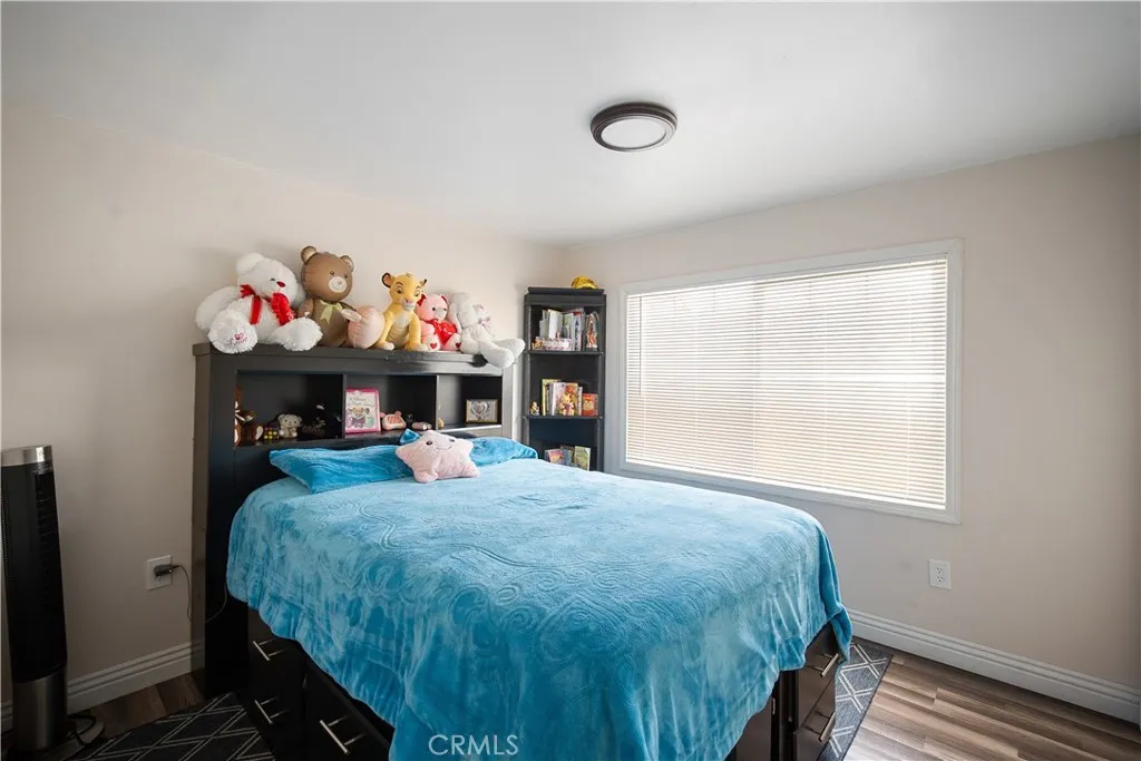 348 Petrol Road Bakersfield, CA 93308 - Photo 18 of 21 a bedroom with a bed and a window