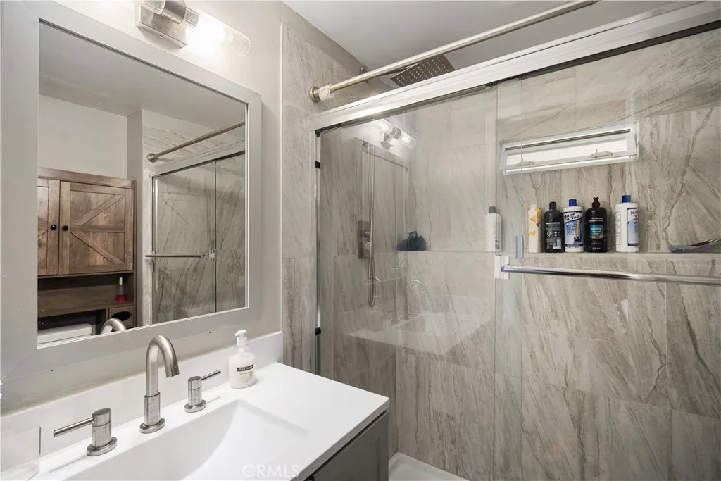 348 Petrol Road Bakersfield, CA 93308 - Photo 19 of 21 a bathroom with a sink and a mirror