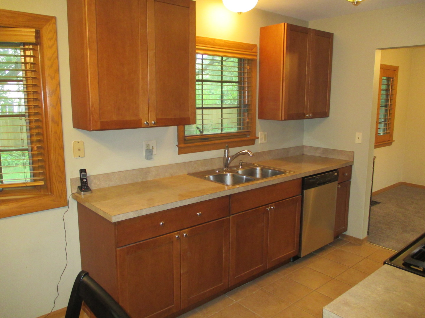30W261 Mack Road Warrenville, IL 60555 - Photo 2 of 28 a room with a sink cabinets and a window