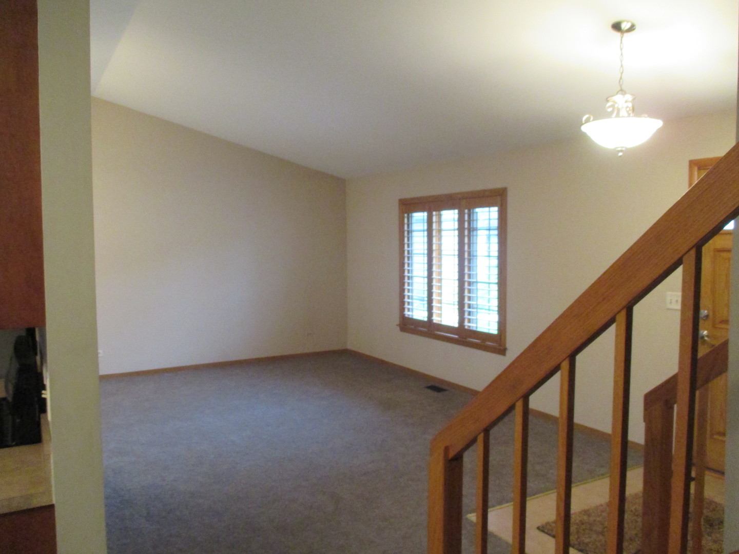 30W261 Mack Road Warrenville, IL 60555 - Photo 11 of 28 a view of an empty room with wooden floor and windows