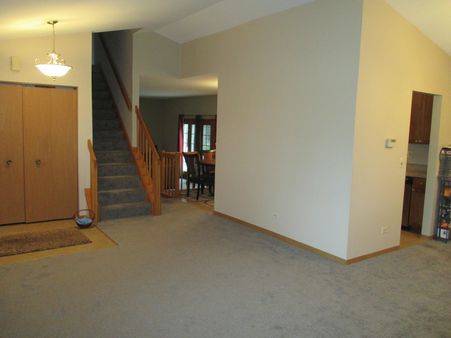 30W261 Mack Road Warrenville, IL 60555 - Photo 12 of 28 an empty room with stairs and a hallway