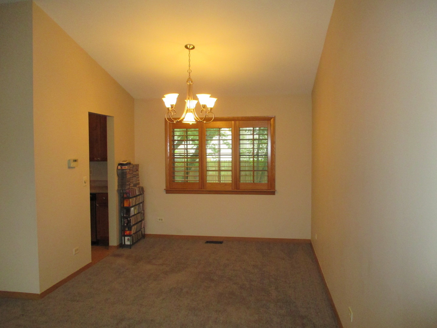 30W261 Mack Road Warrenville, IL 60555 - Photo 14 of 28 en empty room with windows and chandelier