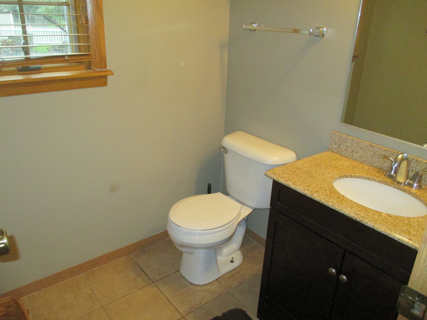 30W261 Mack Road Warrenville, IL 60555 - Photo 15 of 28 a bathroom with a granite countertop toilet and a sink