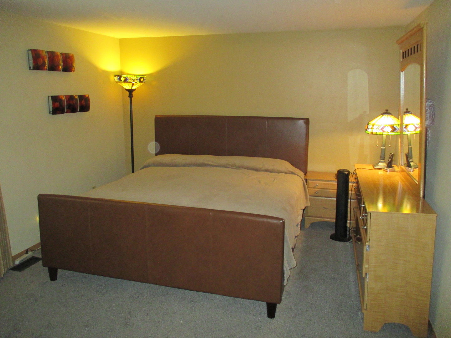 30W261 Mack Road Warrenville, IL 60555 - Photo 16 of 28 a bed sitting in a bathroom and a lamp