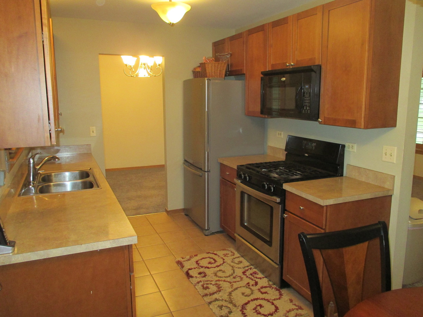 30W261 Mack Road Warrenville, IL 60555 - Photo 3 of 28 a kitchen that has a sink and a stove