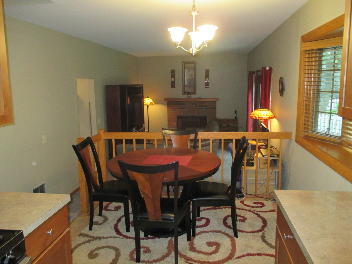 30W261 Mack Road Warrenville, IL 60555 - Photo 6 of 28 a dining room with furniture a chandelier and wooden floor