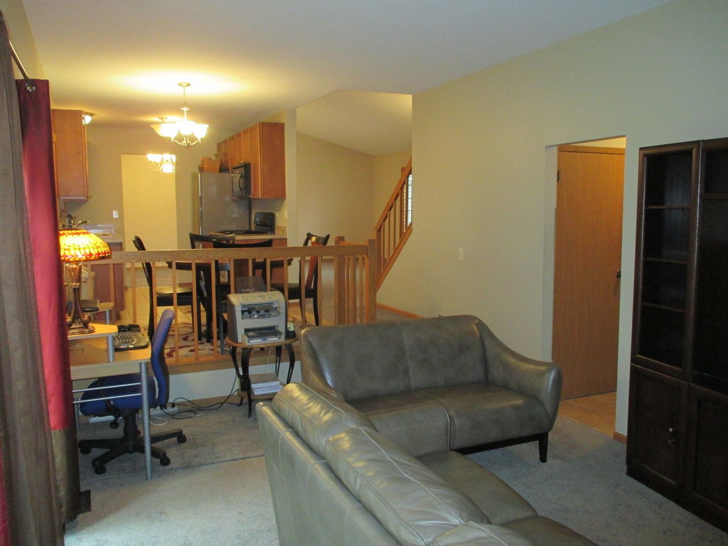 30W261 Mack Road Warrenville, IL 60555 - Photo 10 of 28 a living room with furniture and a dining table with kitchen view