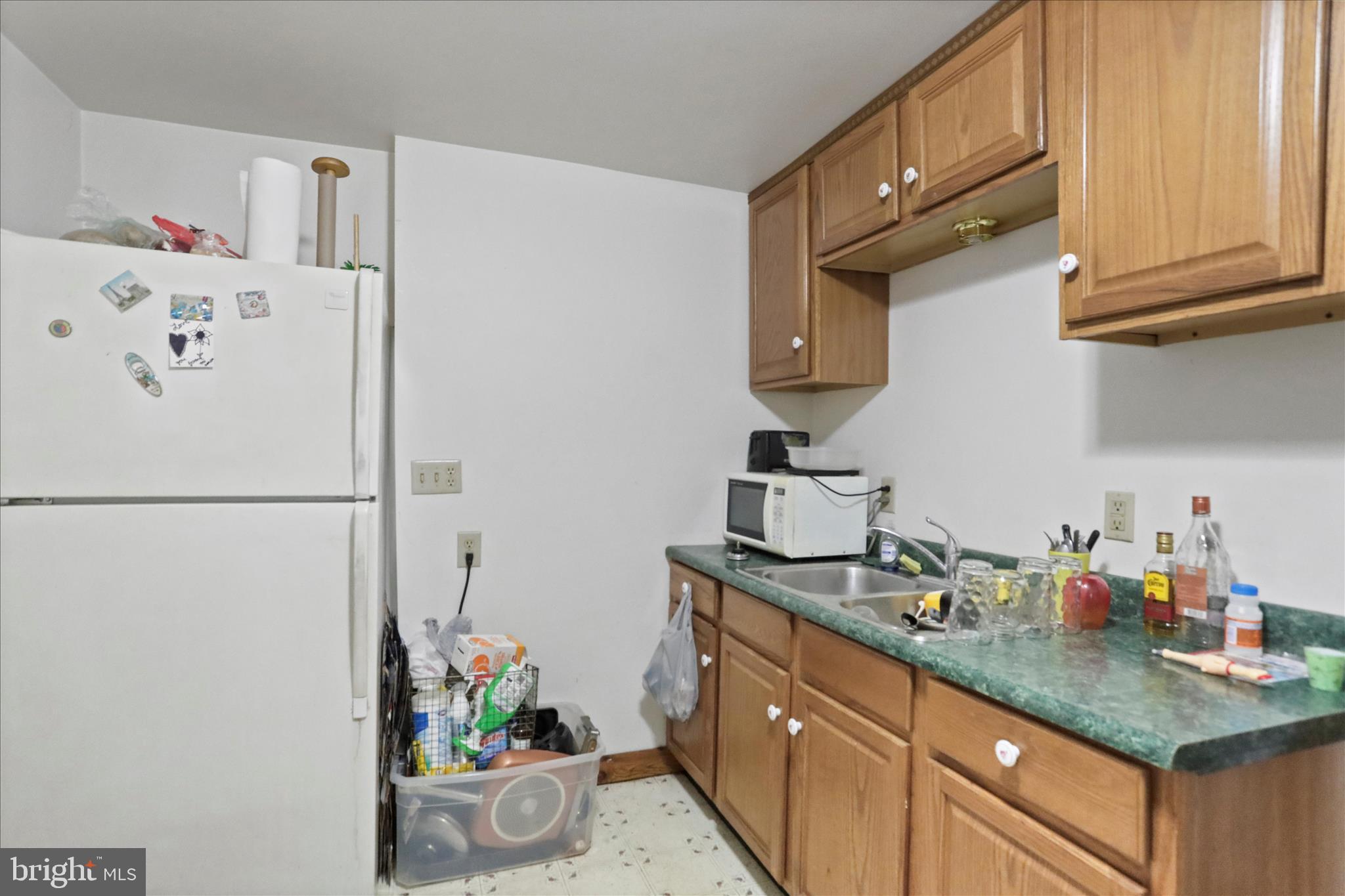 20 East Madison Street Greencastle, PA 17225 - Photo 11 of 36 a kitchen with stainless steel appliances a refrigerator and a cabinets