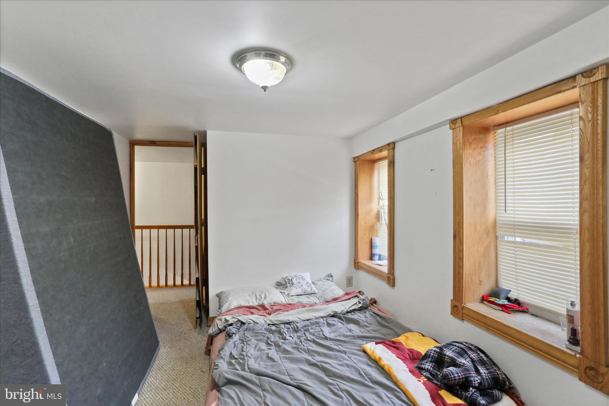 20 East Madison Street Greencastle, PA 17225 - Photo 16 of 36 a bedroom with a bed and a window