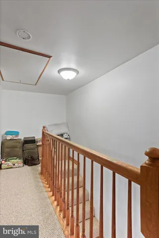 a view of staircase with white walls