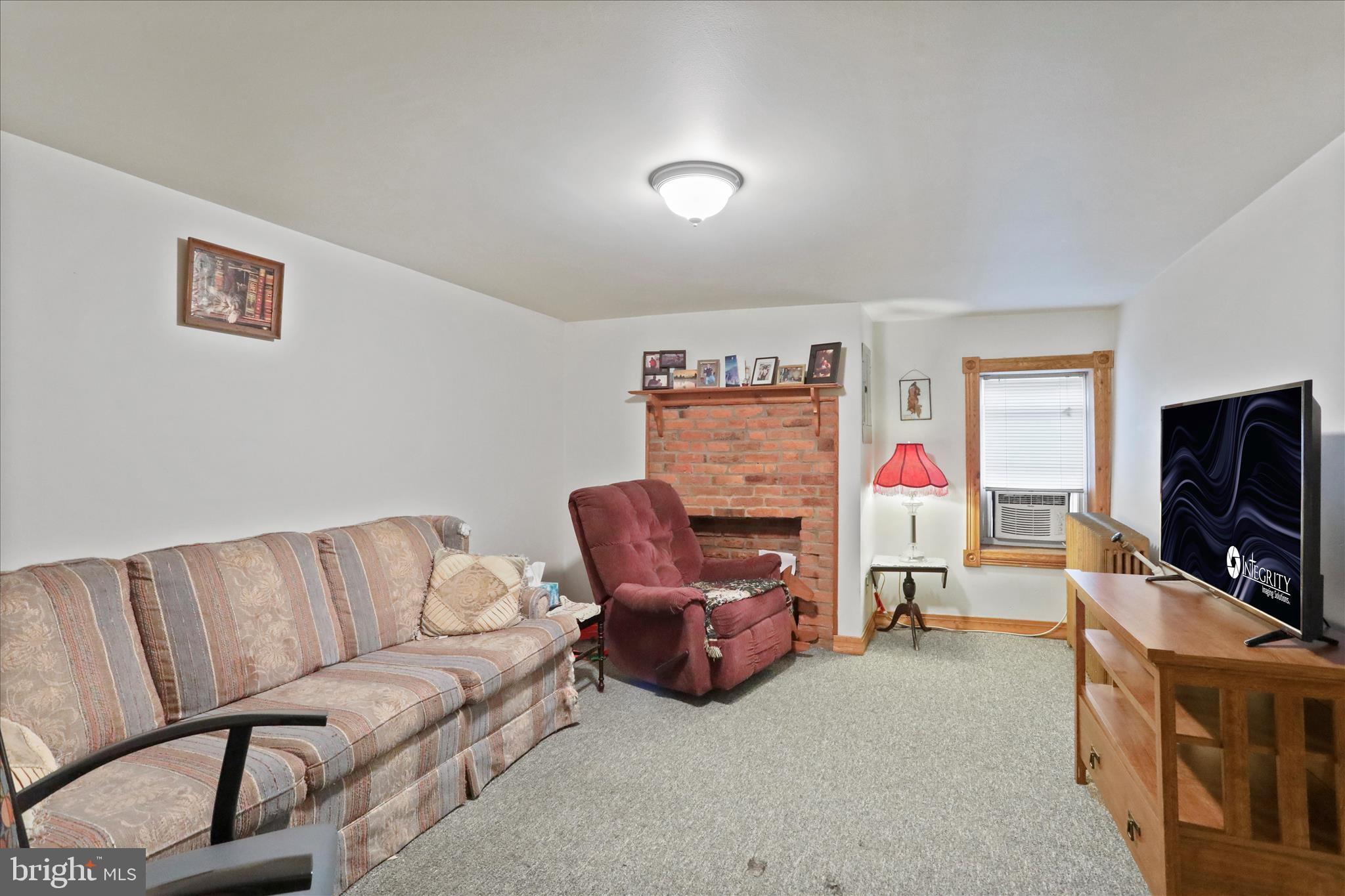 20 East Madison Street Greencastle, PA 17225 - Photo 23 of 36 a living room with furniture and a flat screen tv