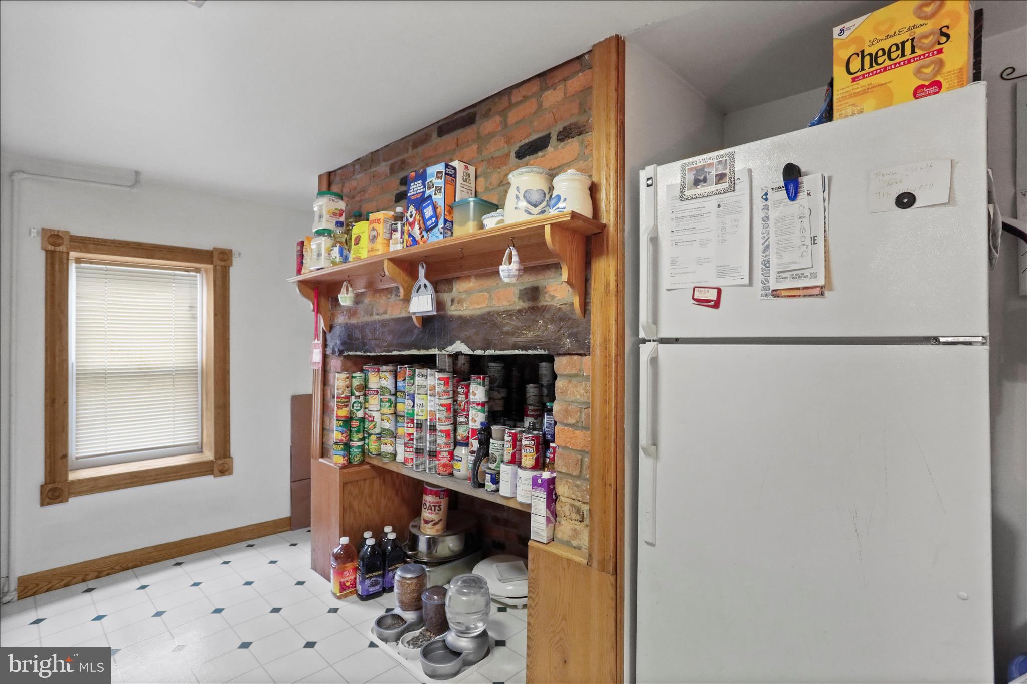 20 East Madison Street Greencastle, PA 17225 - Photo 26 of 36 a white refrigerator freezer sitting inside of a kitchen