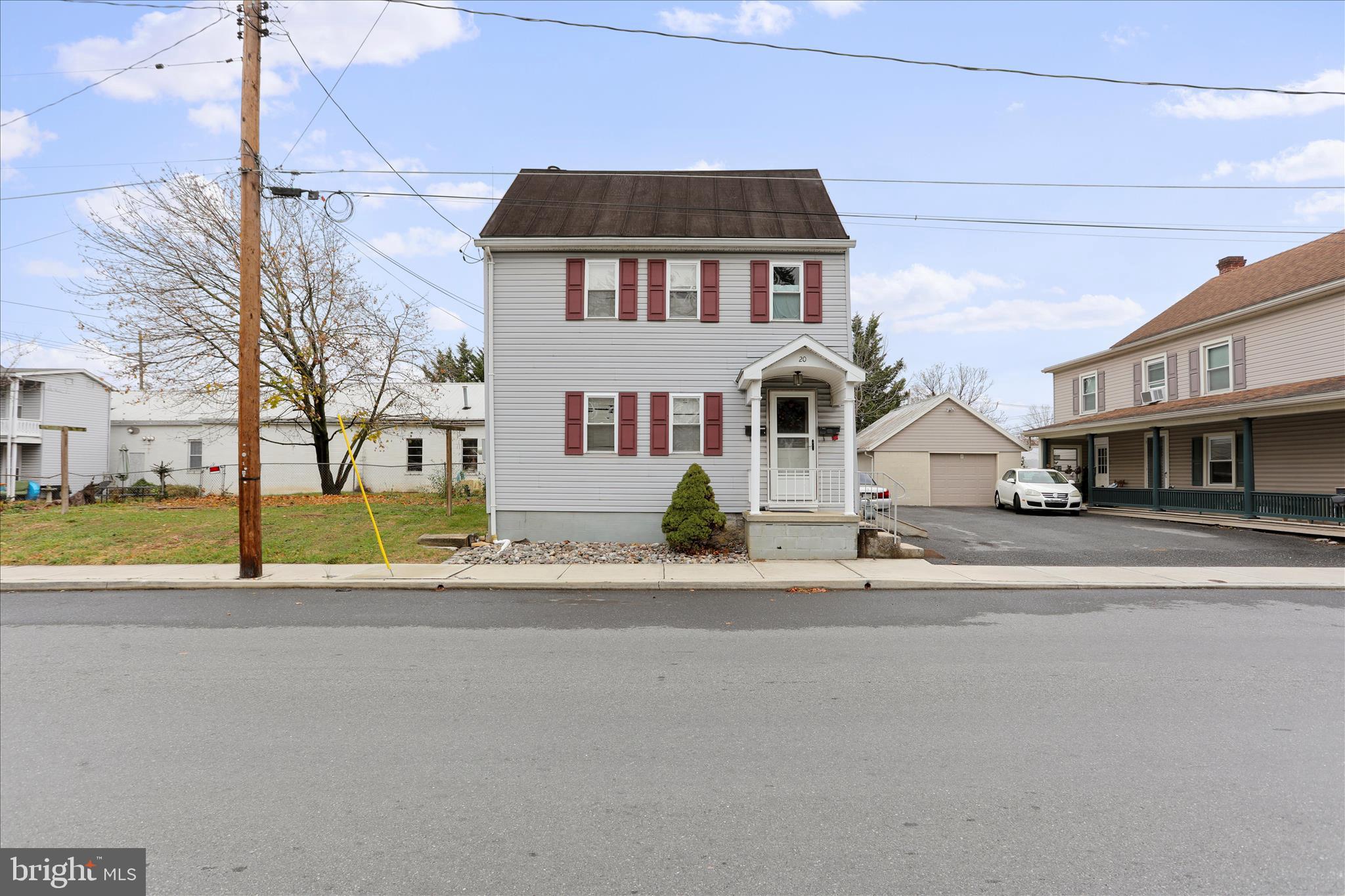 20 East Madison Street Greencastle, PA 17225 - Photo 3 of 36 a front view of a house with a yard