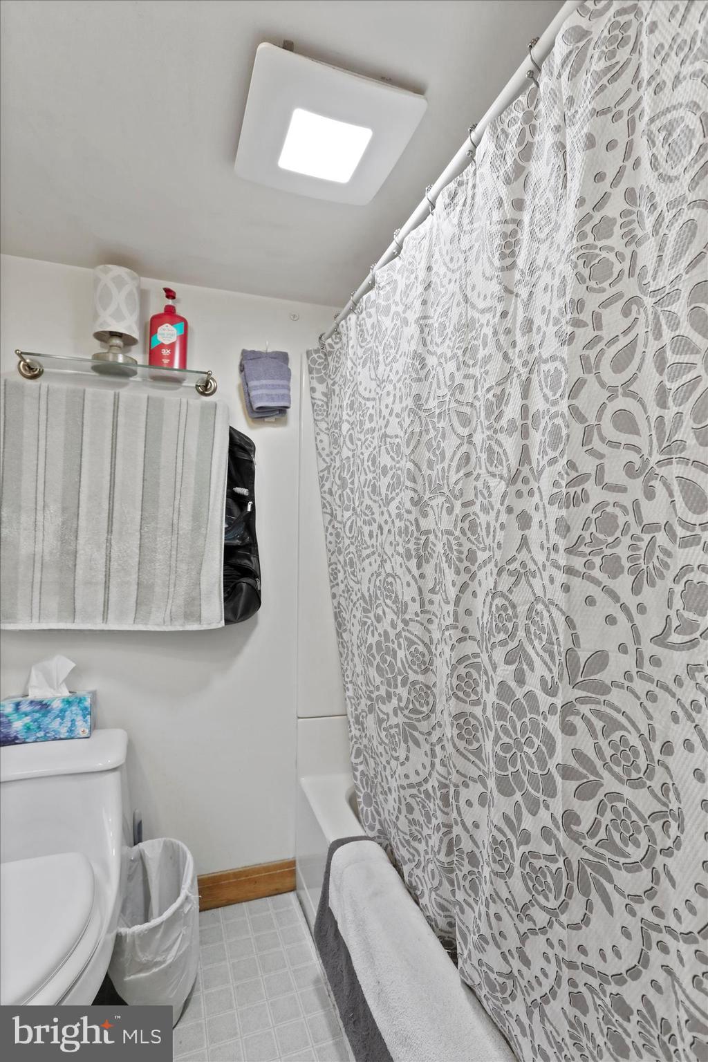 20 East Madison Street Greencastle, PA 17225 - Photo 32 of 36 a bathroom with a toilet and a shower curtain