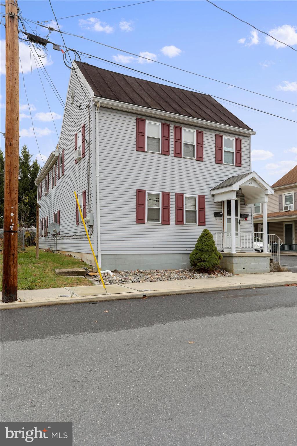 20 East Madison Street Greencastle, PA 17225 - Photo 5 of 36 a front view of a house with a yard