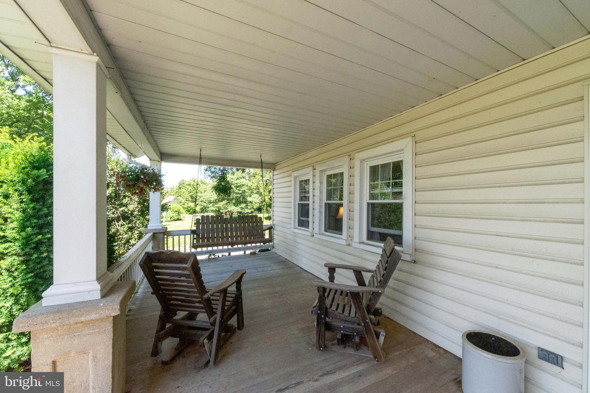 5533 New Park Road White Hall, MD 21161 - Photo 7 of 77 Front Covered Porch - swing & matching chairs incl