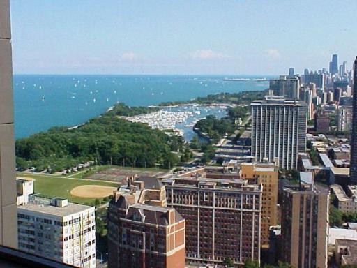 655 West Irving Park Road, Unit 4413 Chicago, IL 60613 - Photo 2 of 11 a view of a city with tall buildings