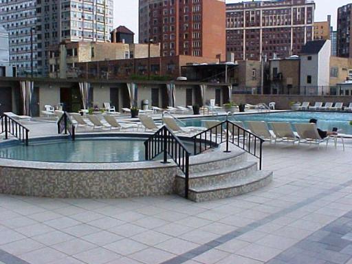 655 West Irving Park Road, Unit 4413 Chicago, IL 60613 - Photo 9 of 11 a view of a building with a swimming pool