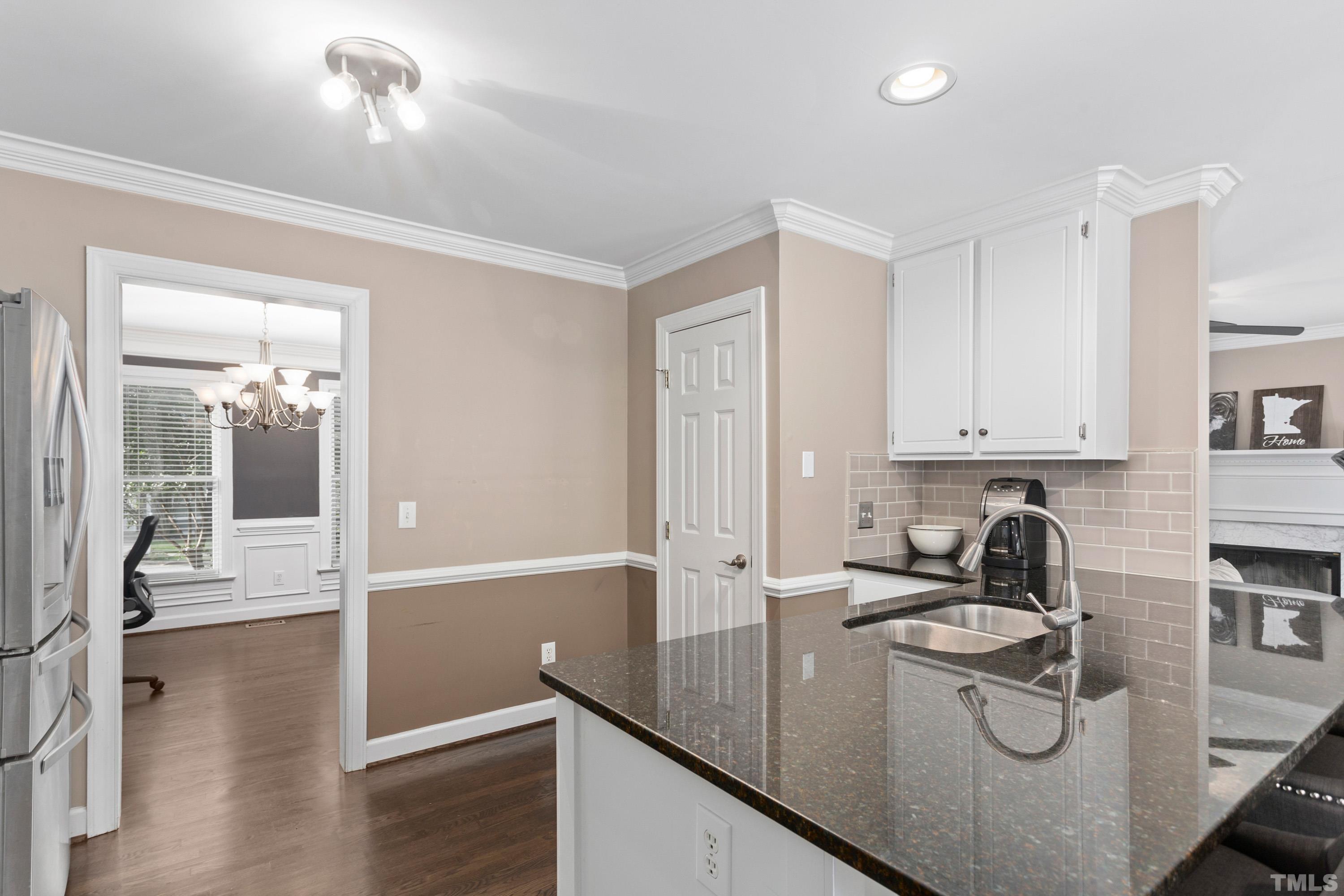 2933 Dahlgreen Road Raleigh, NC 27615 - Photo 10 of 31 a kitchen with a sink and cabinets
