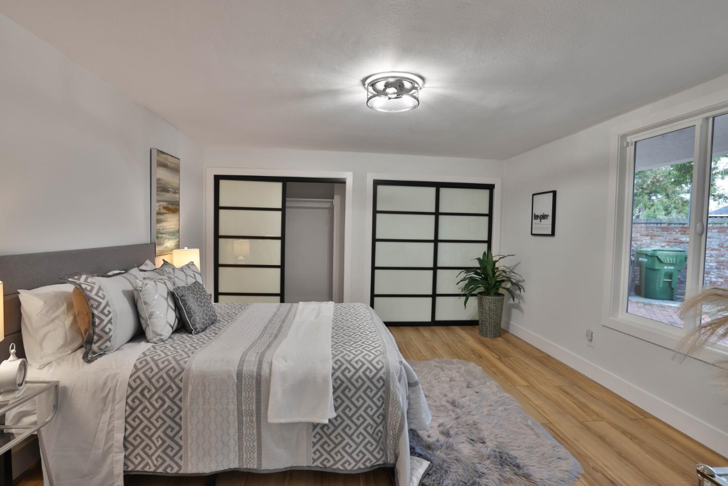 1280 Burrows Road Campbell, CA 95008 - Photo 17 of 47 a bedroom with a large bed and a window