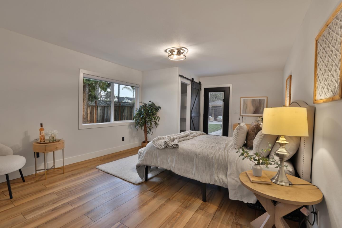 1280 Burrows Road Campbell, CA 95008 - Photo 21 of 47 a bedroom with a bed and wooden floor