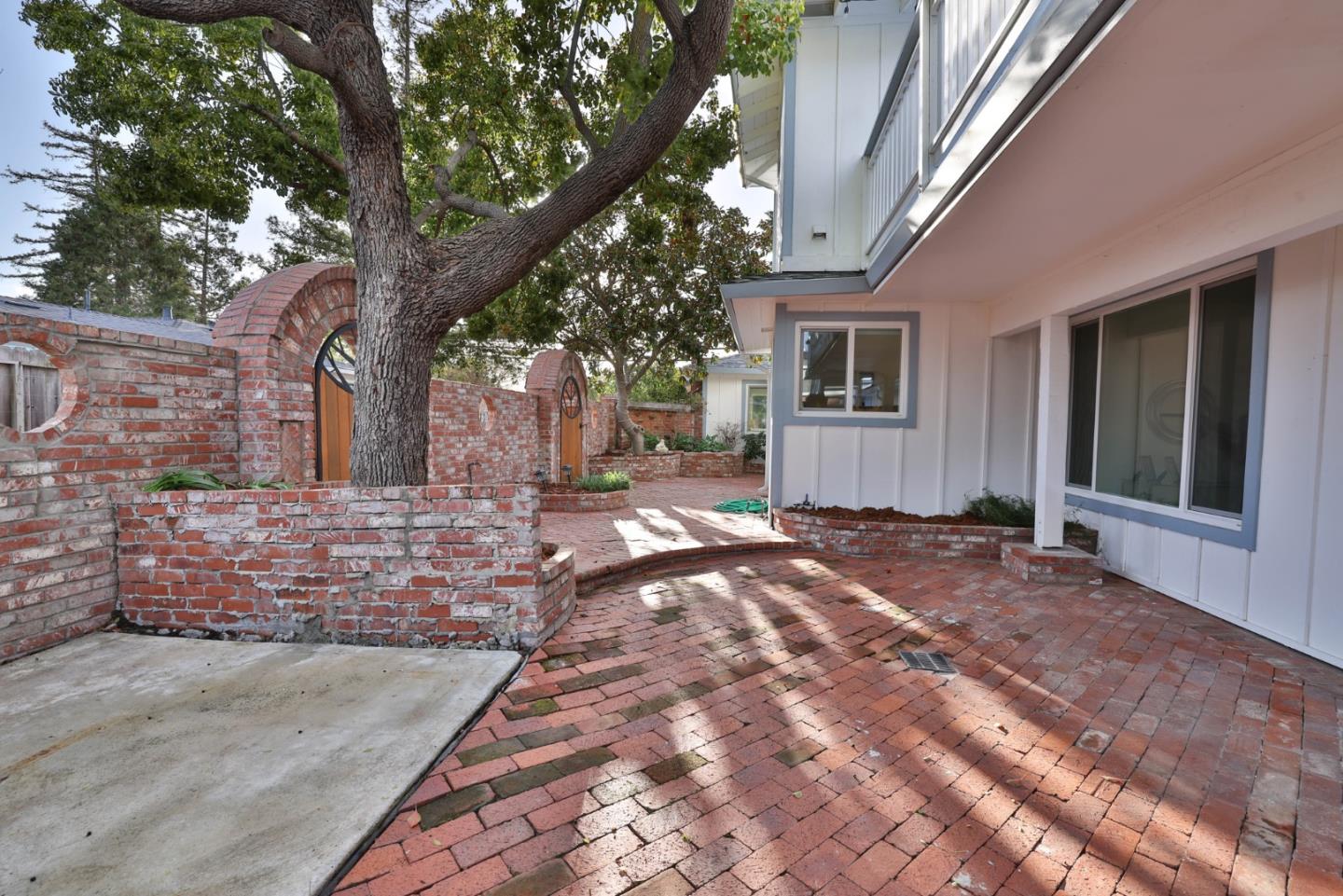 1280 Burrows Road Campbell, CA 95008 - Photo 31 of 47 a view of house with backyard and trees in the background