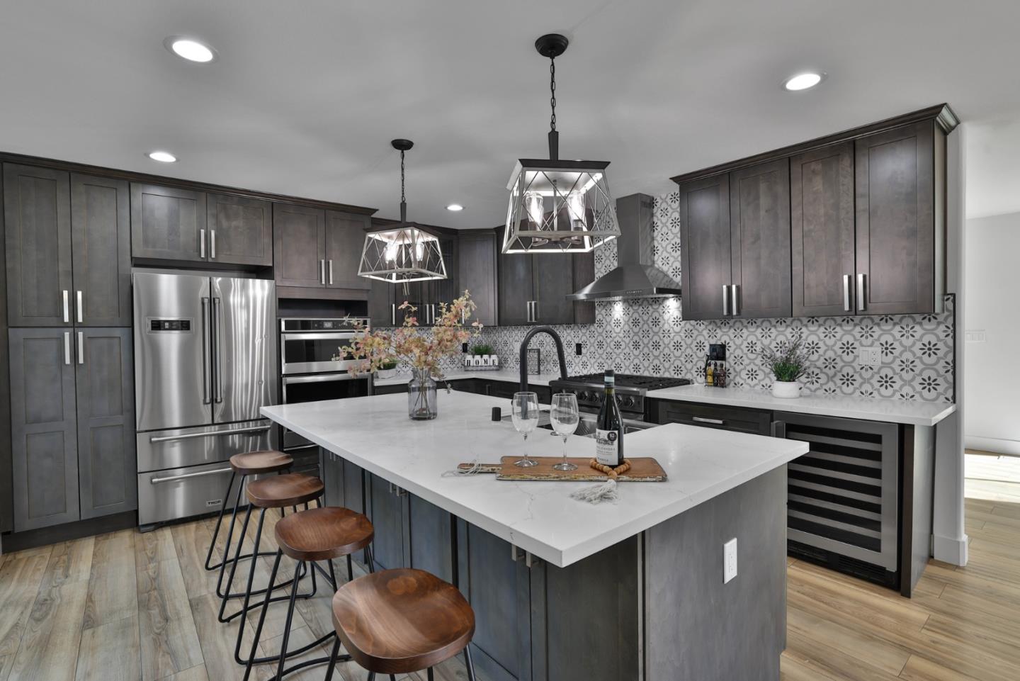 1280 Burrows Road Campbell, CA 95008 - Photo 5 of 47 a kitchen with stainless steel appliances kitchen island granite countertop a sink a refrigerator and a stove