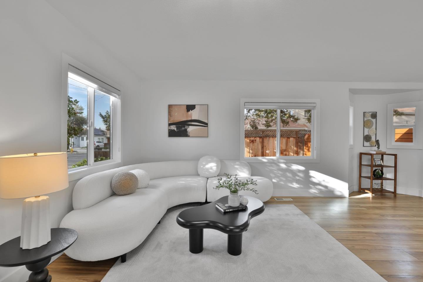 1280 Burrows Road Campbell, CA 95008 - Photo 9 of 47 a living room with furniture couches and a dining table with wooden floor