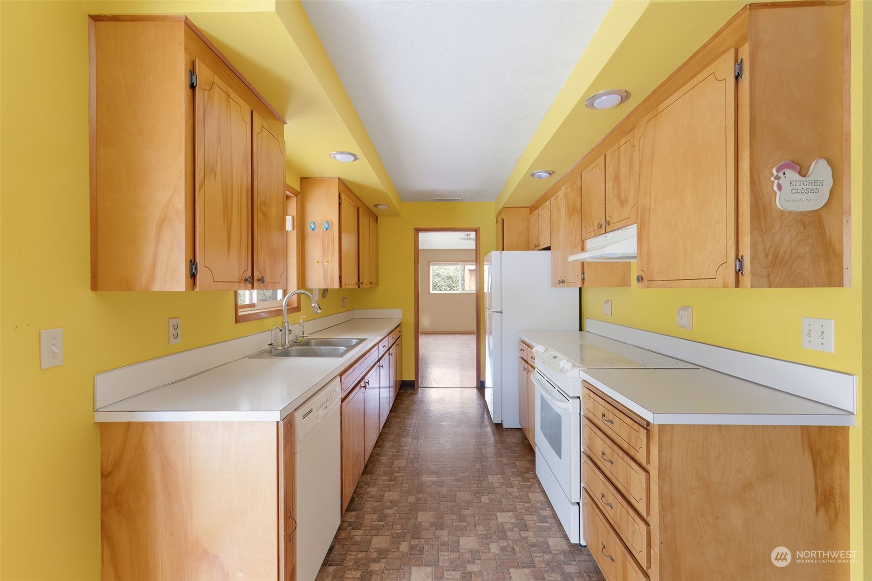 521 Robertson Road Longview, WA 98632 - Photo 13 of 40 a kitchen with a sink and a refrigerator