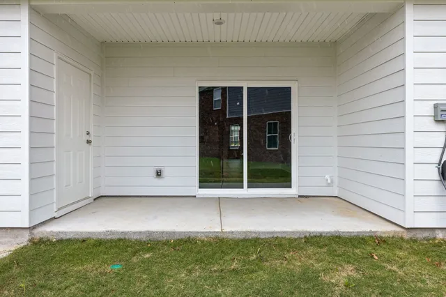 a view of a house with a swimming pool and a window