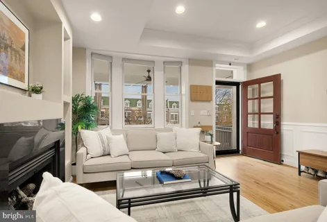 a living room with furniture and a rug