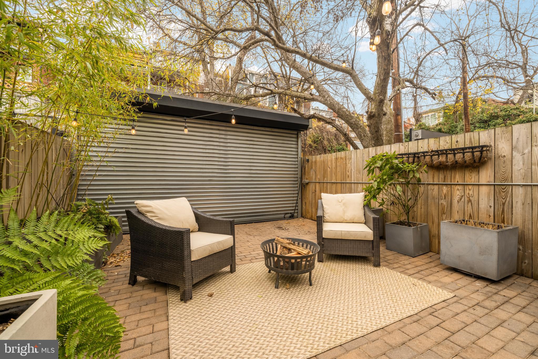 1813 Kilbourne Place Northwest Washington, DC 20010 - Photo 29 of 69 Back patio/parking space with roll up gate