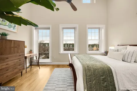 a bathroom with a double vanity sink mirror and toilet