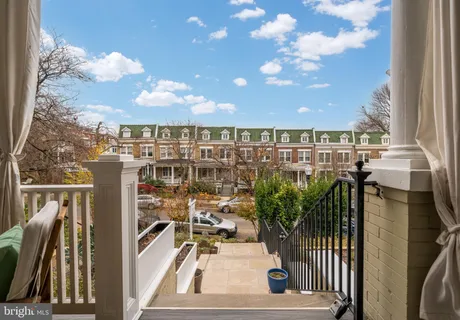 a view of a balcony with city view