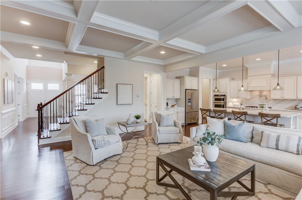 632 Rio Vista Court Suwanee, GA 30024 - Photo 14 of 64 a living room with furniture a table and kitchen view