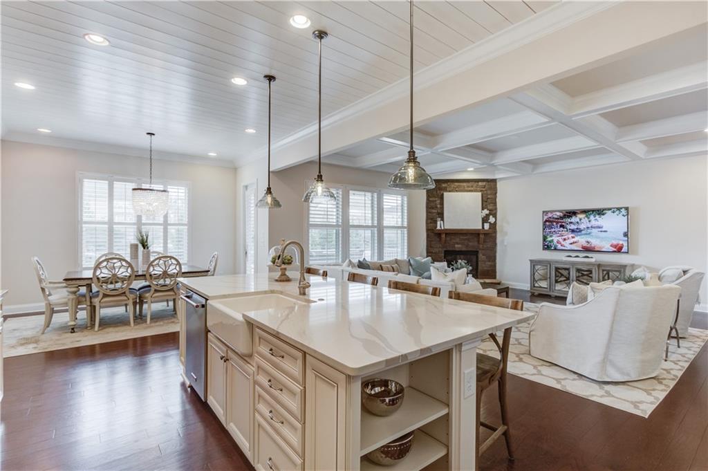 632 Rio Vista Court Suwanee, GA 30024 - Photo 16 of 64 a open kitchen with stainless steel appliances granite countertop a stove and a table
